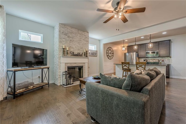 3291 Wild Basil Ln, Buford, GA 30519 - living area with dark wood-type flooring, ceiling fan, healthy amount of natural light, a fireplace, and recessed lighting