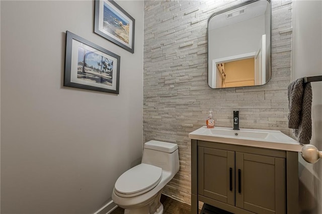3291 Wild Basil Ln, Buford, GA 30519 - half bathroom featuring vanity and toilet