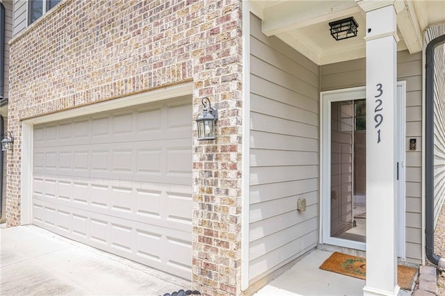 3291 Wild Basil Ln, Buford, GA 30519 - doorway to property featuring brick siding and a garage
