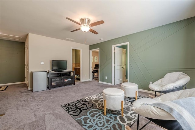 3291 Wild Basil Ln, Buford, GA 30519 - carpeted living room with a ceiling fan and a decorative wall