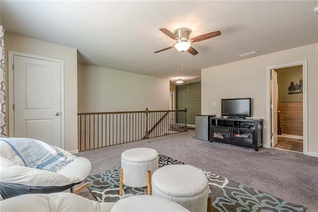 3291 Wild Basil Ln, Buford, GA 30519 - carpeted living area with ceiling fan and baseboards