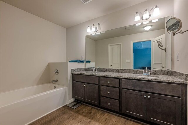 3291 Wild Basil Ln, Buford, GA 30519 - full bath featuring wood finished floors, double vanity, and a bath
