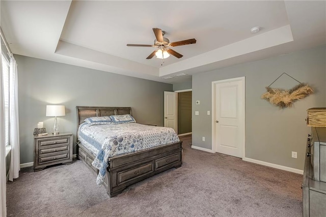 3291 Wild Basil Ln, Buford, GA 30519 - carpeted bedroom with a tray ceiling and a ceiling fan