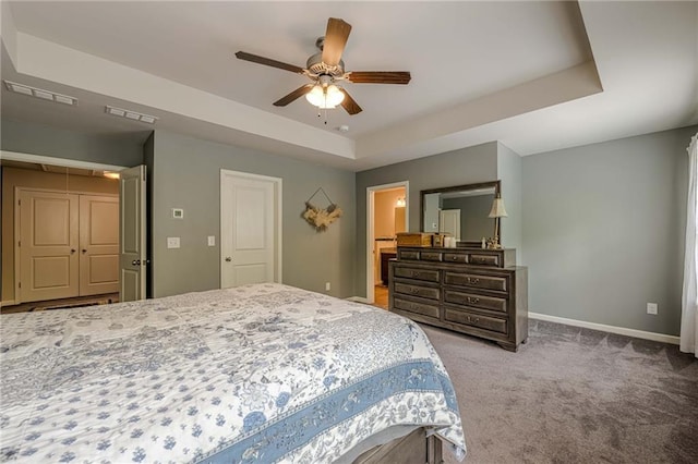 3291 Wild Basil Ln, Buford, GA 30519 - bedroom featuring a raised ceiling, carpet floors, and a ceiling fan