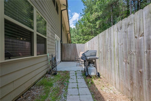 3291 Wild Basil Ln, Buford, GA 30519 - view of side of property featuring a fenced backyard and a patio area