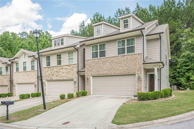 3291 Wild Basil Ln, Buford, GA 30519 - view of property featuring an attached garage, concrete driveway, and a front lawn