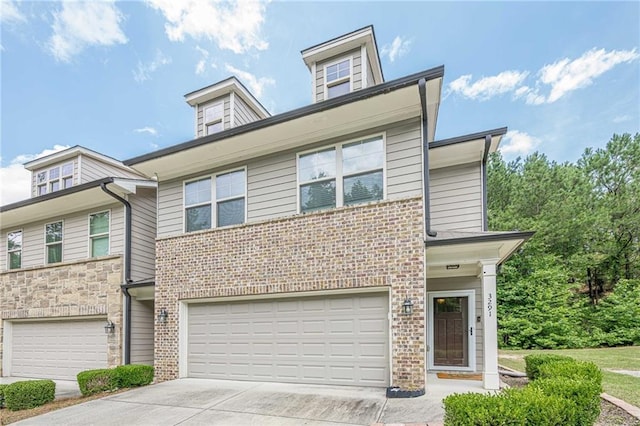 3291 Wild Basil Ln, Buford, GA 30519 - townhome / multi-family property with concrete driveway, an attached garage, and brick siding