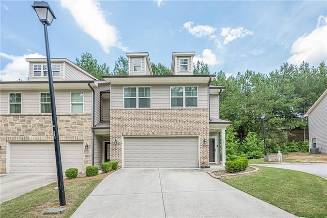 3291 Wild Basil Ln, Buford, GA 30519 - townhome / multi-family property featuring concrete driveway, an attached garage, and a front lawn
