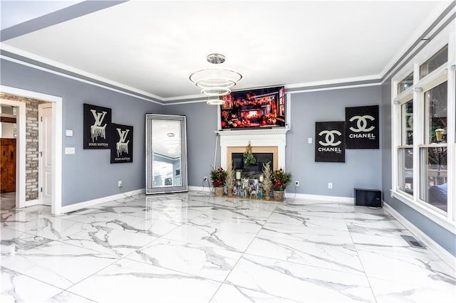 unfurnished living room featuring crown molding