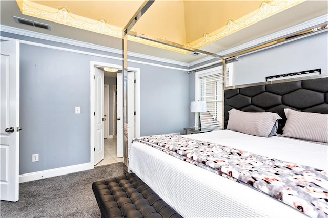 bedroom with crown molding and carpet floors