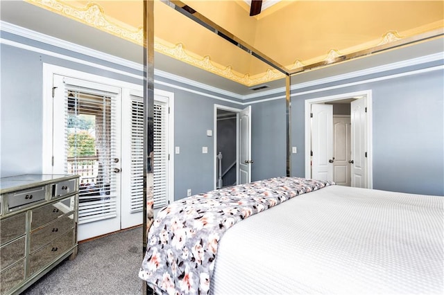 bedroom featuring crown molding, carpet, and access to exterior