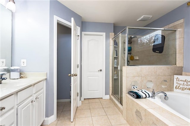 bathroom with vanity, independent shower and bath, and tile patterned flooring