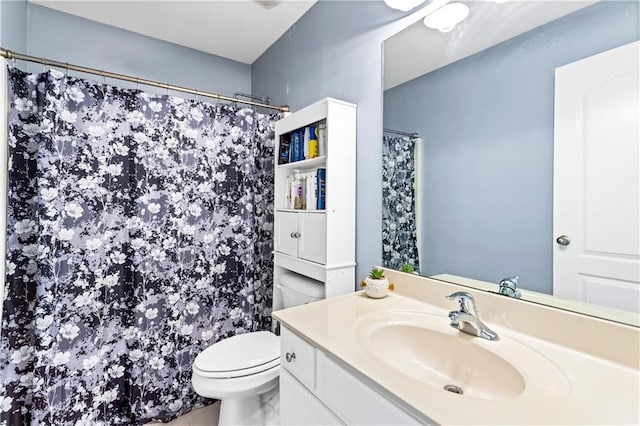 bathroom with vanity, toilet, and a shower with shower curtain