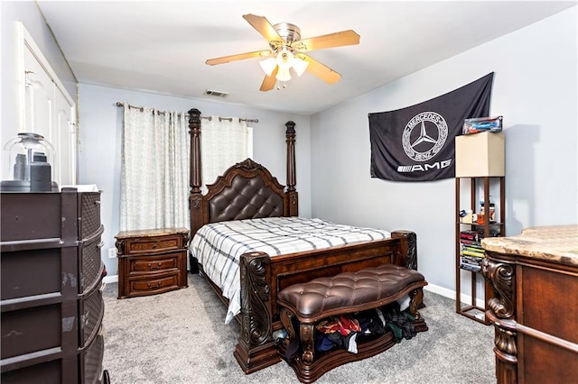 bedroom with light carpet and ceiling fan