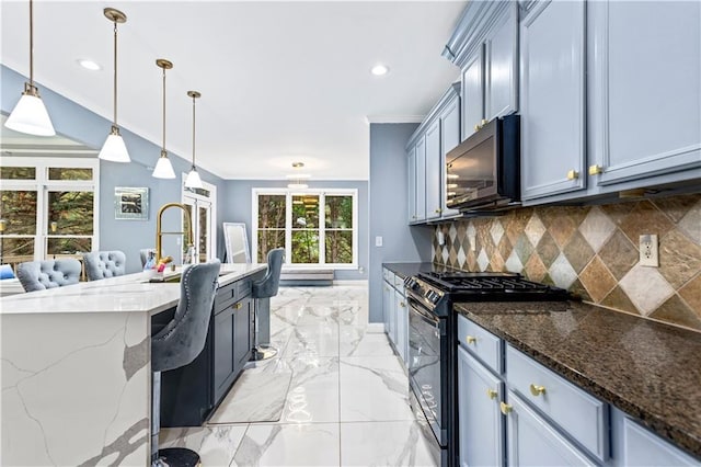 kitchen with black gas range, dark stone countertops, tasteful backsplash, ornamental molding, and decorative light fixtures