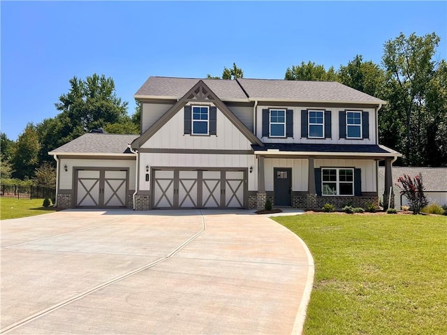 view of front of property with a garage and a front yard