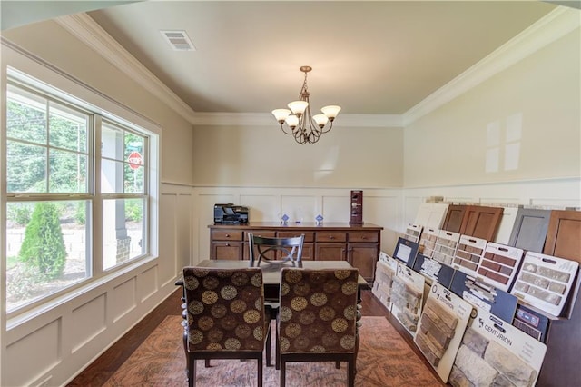 office featuring dark hardwood / wood-style flooring, crown molding, and a chandelier