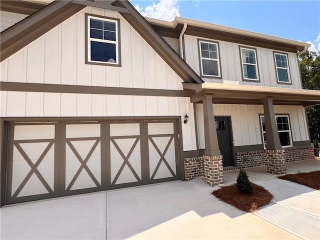 view of front facade with a garage and covered porch