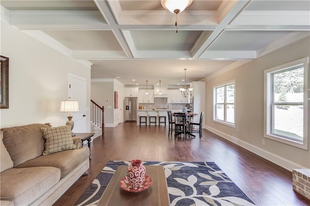 living room with coffered ceiling, beam ceiling, crown molding, and dark hardwood / wood-style floors