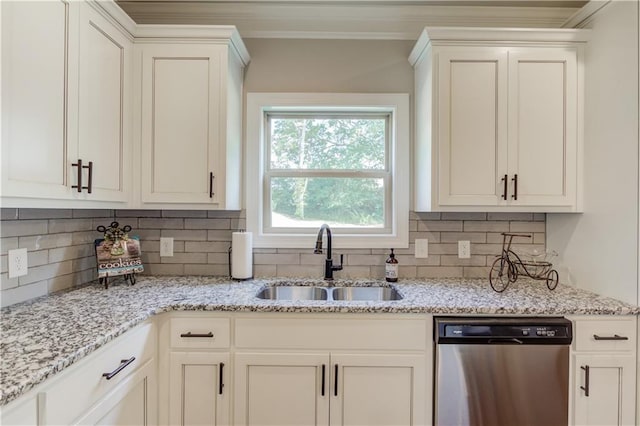 kitchen with sink, crown molding, dishwasher, white cabinetry, and backsplash