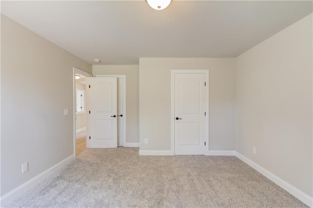 unfurnished bedroom with light carpet