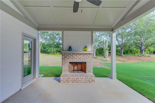 view of patio / terrace with an outdoor brick fireplace and ceiling fan