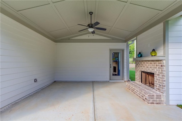 view of patio / terrace featuring an outdoor brick fireplace and ceiling fan