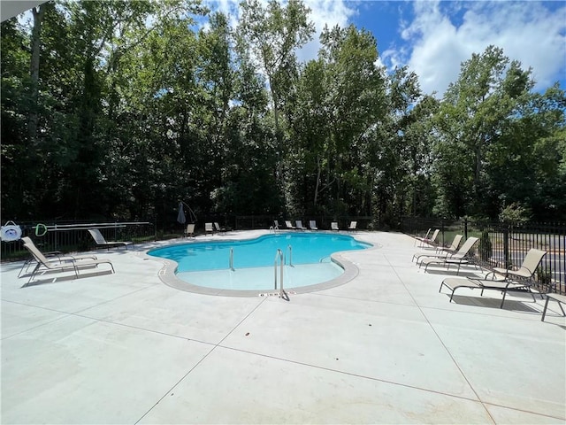 view of pool featuring a patio area