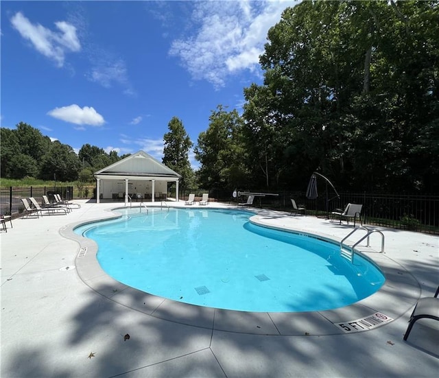 view of swimming pool with a patio