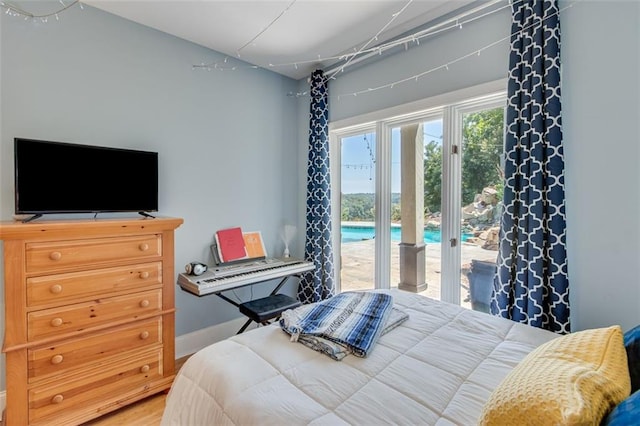 2935 Thompson Mill Rd, Gainesville, GA 30506 - bedroom with access to outside and wood finished floors