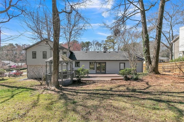 700 Hill Meadow Dr, Dacula, GA 30019 - rear view of house featuring fence, a wooden deck, a gazebo, a lawn, and an attached garage