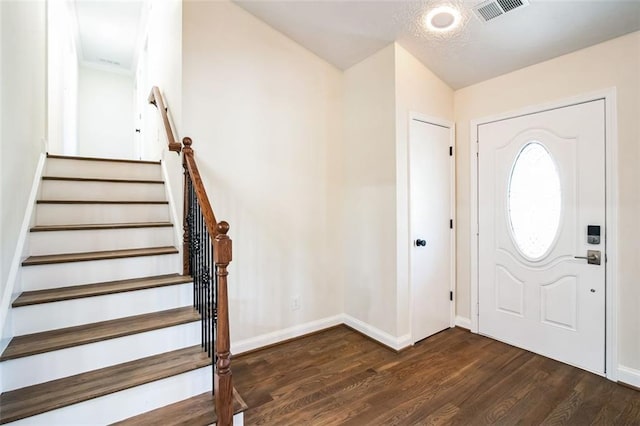 700 Hill Meadow Dr, Dacula, GA 30019 - foyer featuring dark wood finished floors, visible vents, stairs, and baseboards