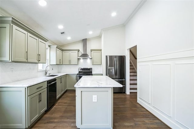 700 Hill Meadow Dr, Dacula, GA 30019 - kitchen with a kitchen island, lofted ceiling, stainless steel appliances, crown molding, and wall chimney exhaust hood