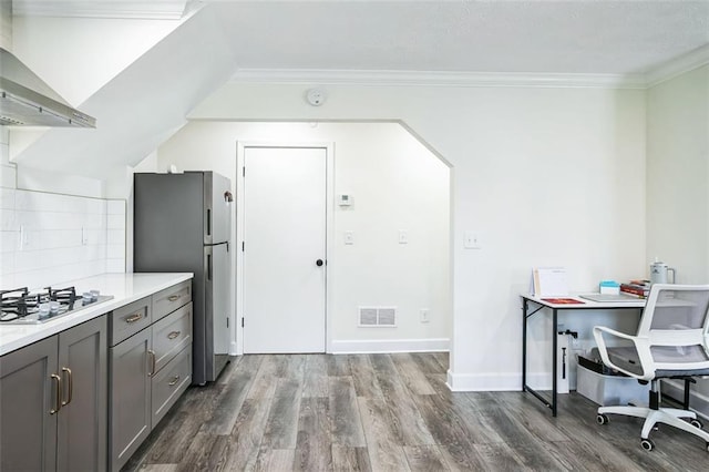700 Hill Meadow Dr, Dacula, GA 30019 - kitchen with visible vents, wall chimney range hood, dark wood finished floors, gray cabinets, and appliances with stainless steel finishes