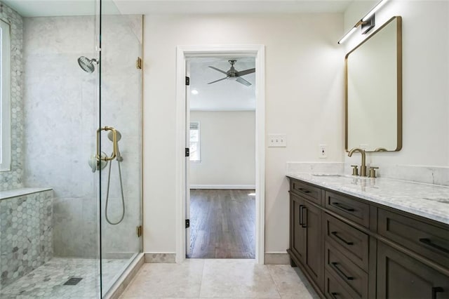 700 Hill Meadow Dr, Dacula, GA 30019 - full bath featuring tile patterned flooring, tiled shower, vanity, and baseboards
