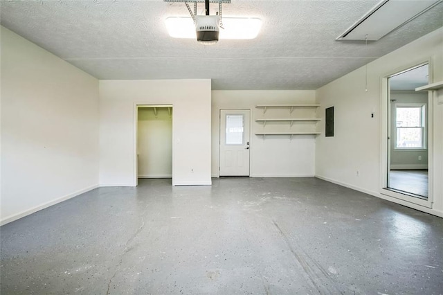 700 Hill Meadow Dr, Dacula, GA 30019 - garage with electric panel, a garage door opener, and baseboards