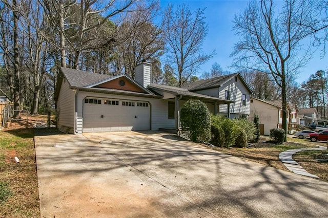 700 Hill Meadow Dr, Dacula, GA 30019 - view of front facade featuring an attached garage, a chimney, and driveway