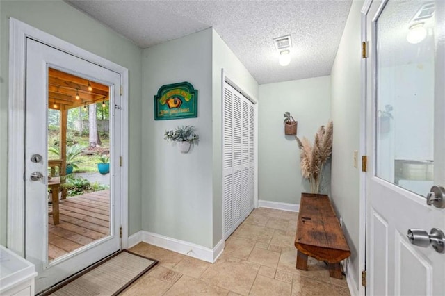 1526 Oakleaf Dr, Auburn, GA 30011 - entryway featuring baseboards and a textured ceiling