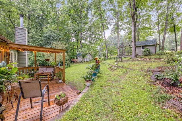 1526 Oakleaf Dr, Auburn, GA 30011 - view of grassy yard featuring a wooden deck and view of scattered trees