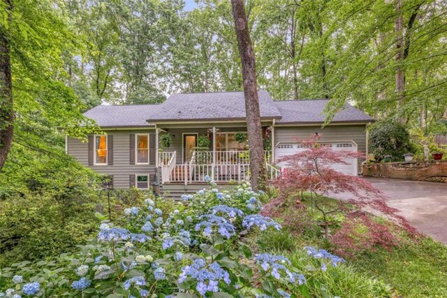 1526 Oakleaf Dr, Auburn, GA 30011 - ranch-style home featuring covered porch, concrete driveway, and an attached garage