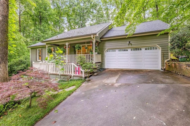 1526 Oakleaf Dr, Auburn, GA 30011 - single story home with a porch, driveway, an attached garage, and roof with shingles