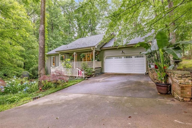 1526 Oakleaf Dr, Auburn, GA 30011 - single story home featuring covered porch, driveway, a garage, and roof with shingles
