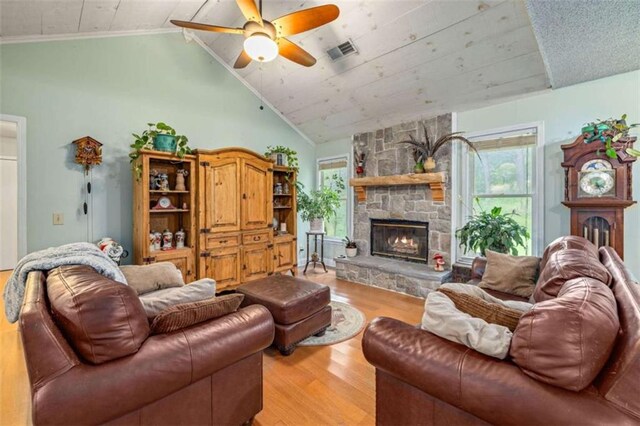 1526 Oakleaf Dr, Auburn, GA 30011 - living area featuring light wood-style floors, lofted ceiling, healthy amount of natural light, a ceiling fan, and a fireplace