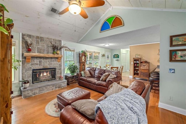 1526 Oakleaf Dr, Auburn, GA 30011 - living room with wood finished floors, ceiling fan, lofted ceiling, baseboards, and a fireplace