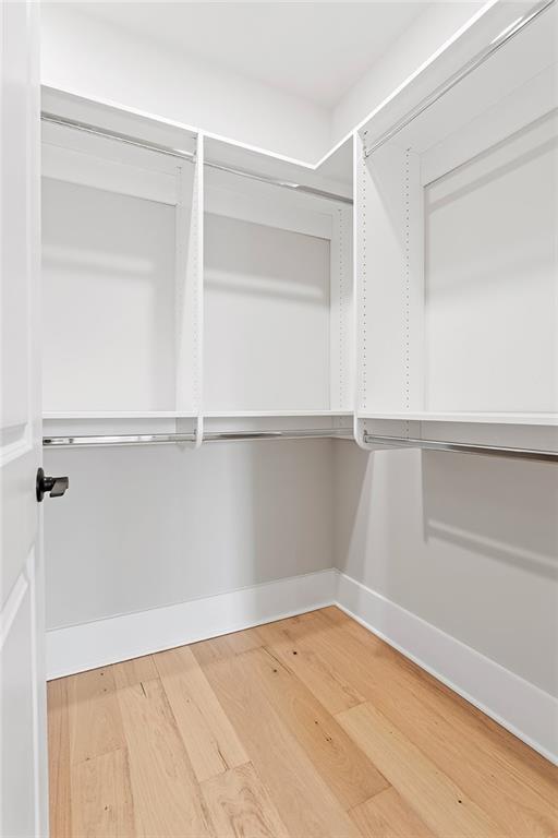 7230 Summit Pl, Alpharetta, GA 30009 - spacious closet featuring wood finished floors