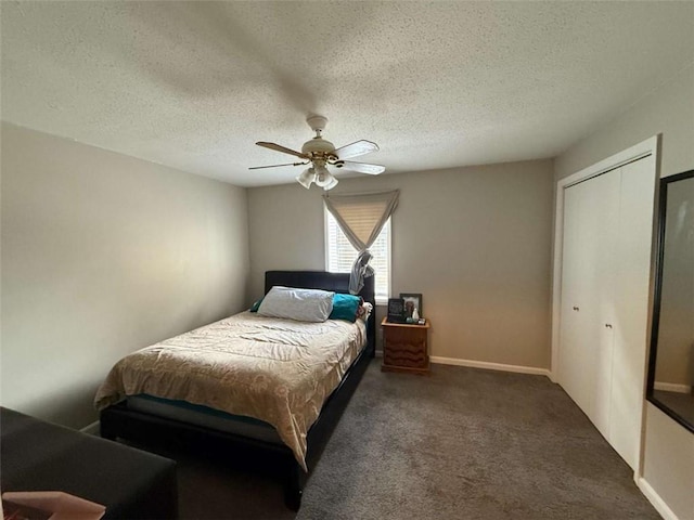 carpeted bedroom featuring a textured ceiling, a closet, and ceiling fan