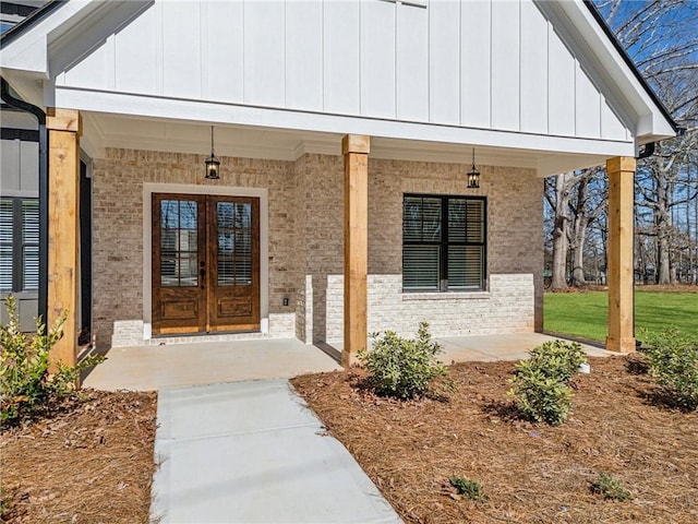 unfurnished living room with a stone fireplace, ornamental molding, dark wood finished floors, and built in features