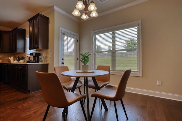 200 Baumgard, Locust Grove, GA 30248 - dining room with a chandelier, ornamental molding, and dark wood finished floors