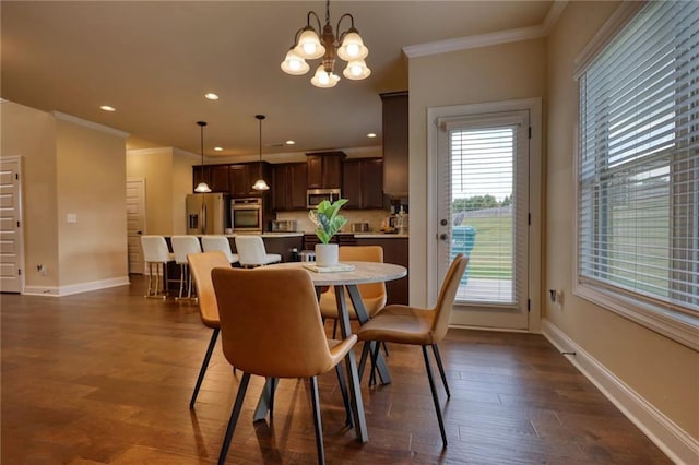 200 Baumgard, Locust Grove, GA 30248 - dining area with ornamental molding, dark wood-type flooring, a chandelier, and recessed lighting
