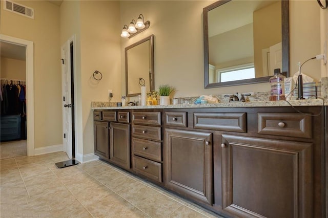 200 Baumgard, Locust Grove, GA 30248 - bathroom with double vanity and tile patterned flooring